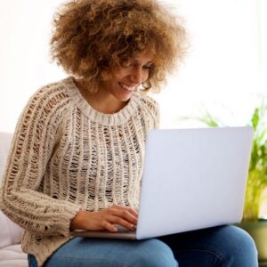 woman sitting with a laptop
